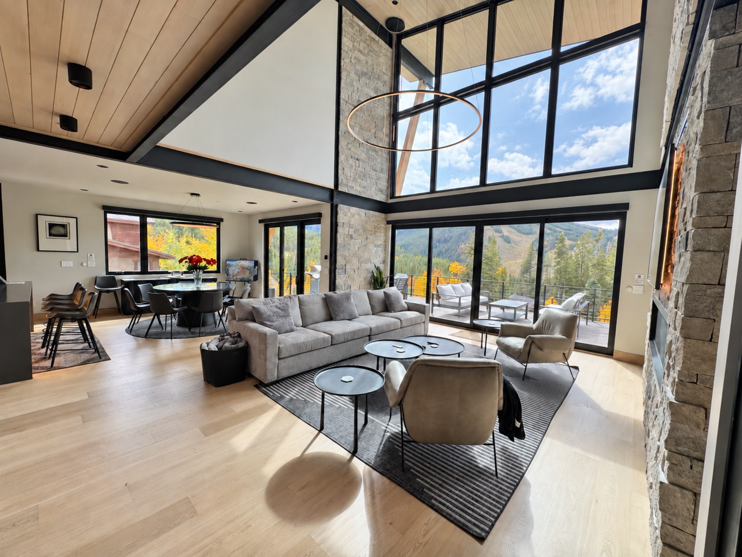 Living room with tall windows and mountain views